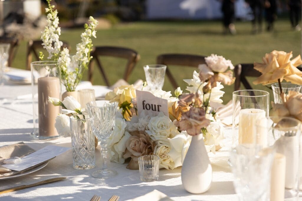 table decor with flowers and center piece at a wedding.