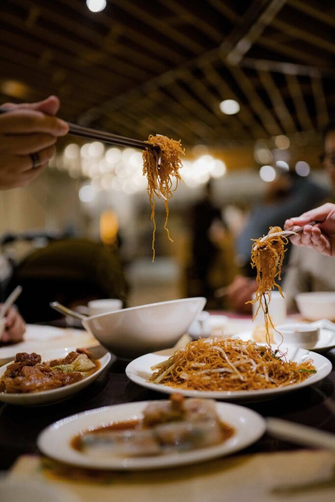 couple eating local rice noodles in bali