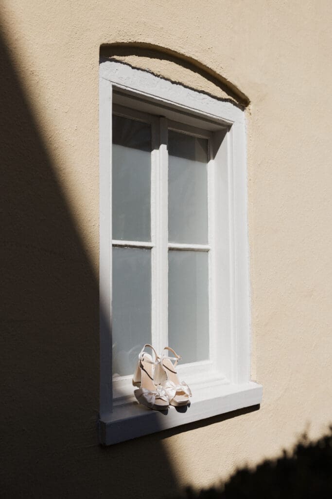 direct sun and shadow with bridal shoes staged on window