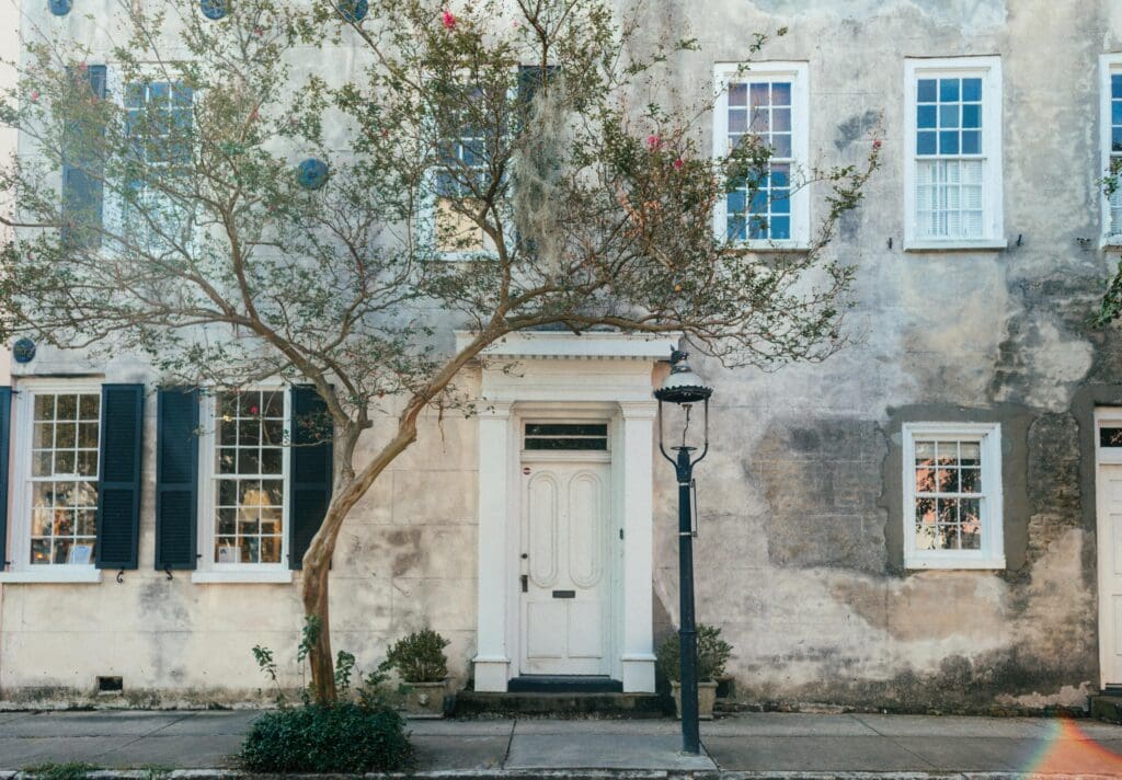downtown historic charleston building with white door.