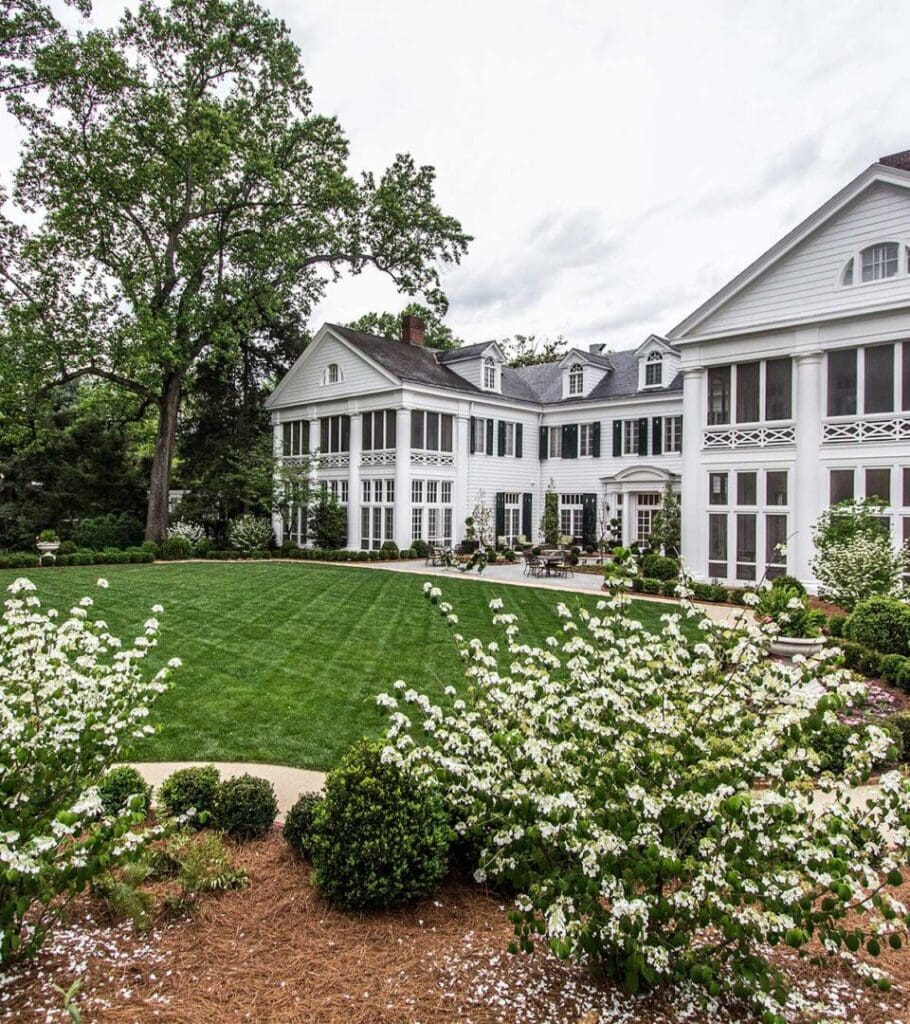 Duke Mansion on a beautiful spring day. Lush green grass, flowers blooming.