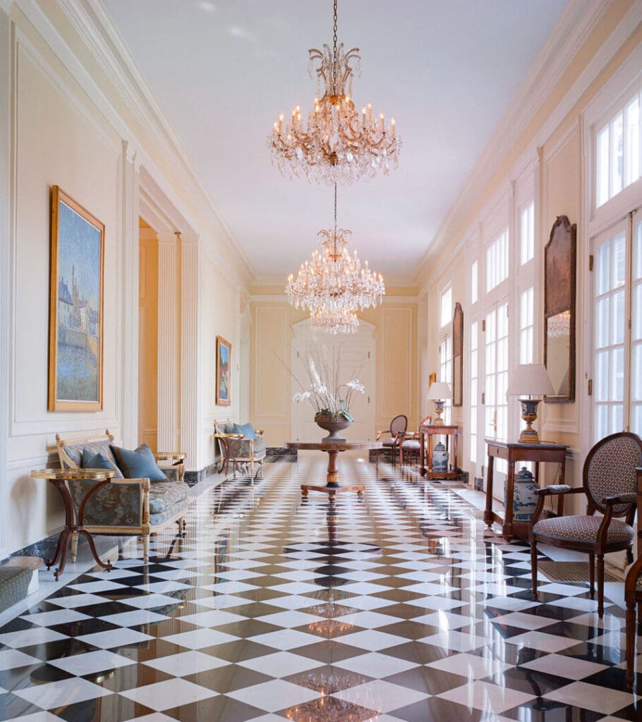Beautiful hallway at duke mansion with checkered tiled floors.
