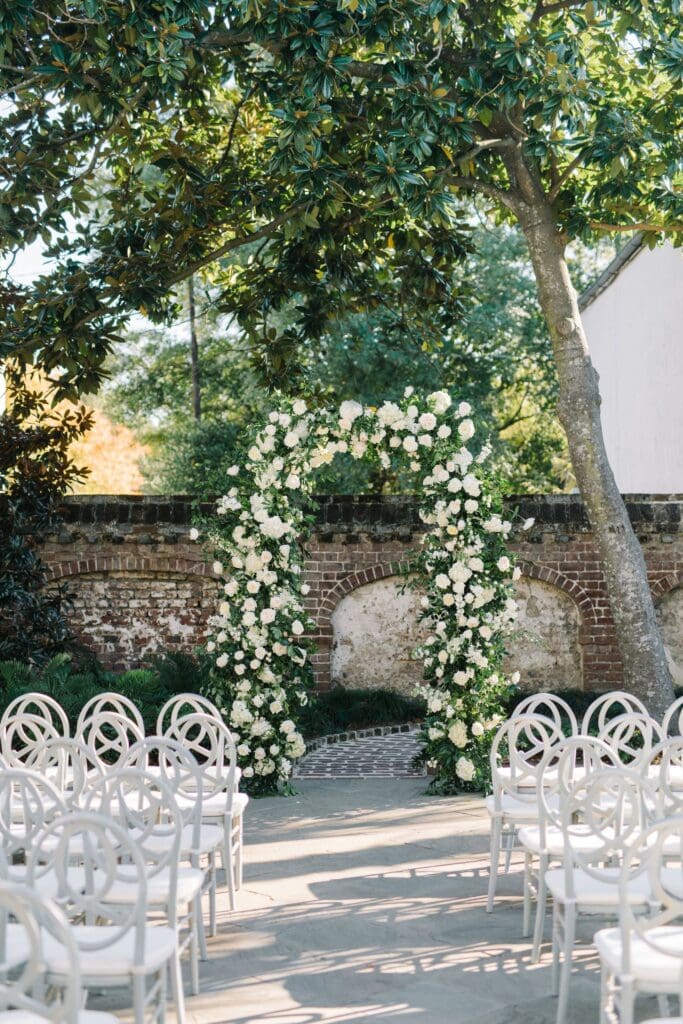 Beautiful floral arrangement at the Gadsden House in front of the alter in the ceremony space.