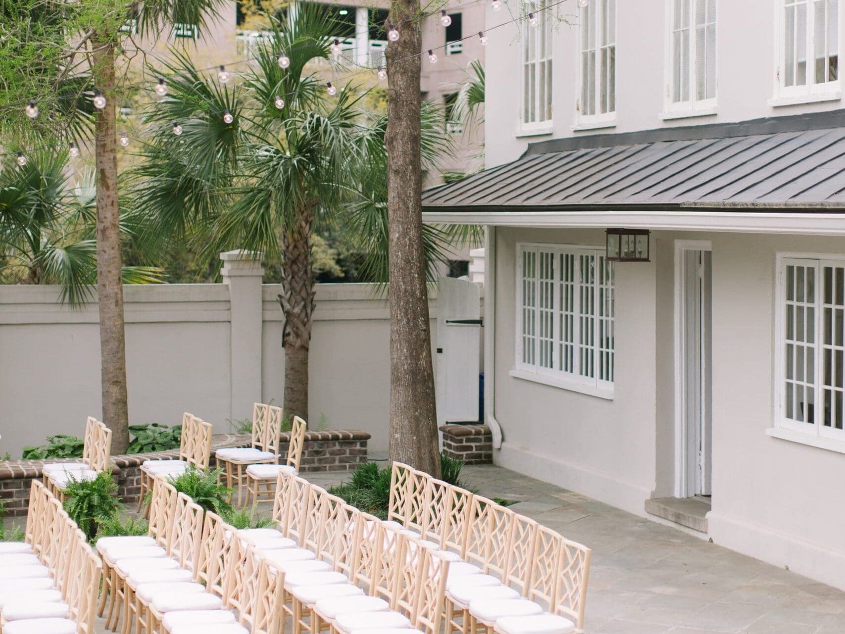 Ceremony space outdoors with wooden chairs at the Gadsden House.