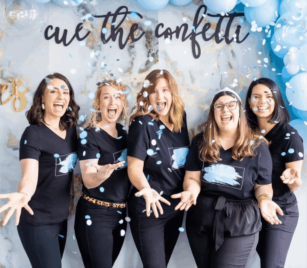5 ladies of excited and throwing confetti in charleston