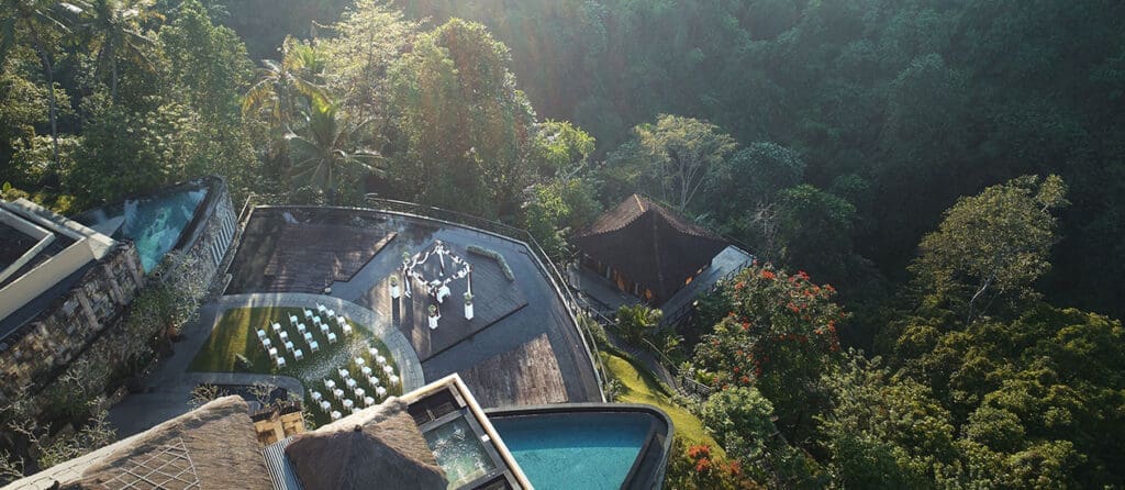 Beautiful drone photograph of the ceremony space with a back drop of the jungle with amazing lighting.