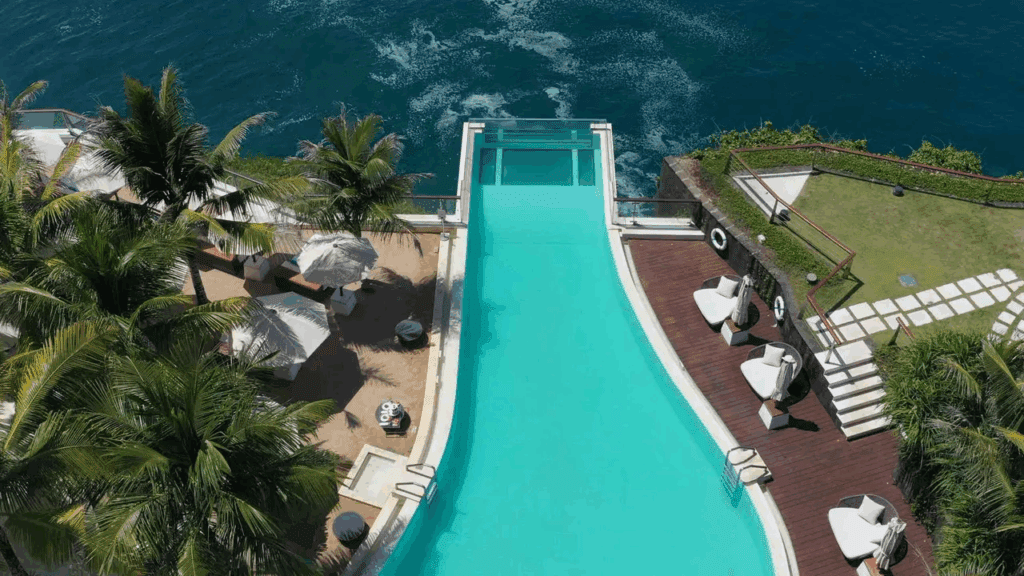 Amazing pool that hangs over the cliff edge in bali at The Edge Bali (Uluwatu).