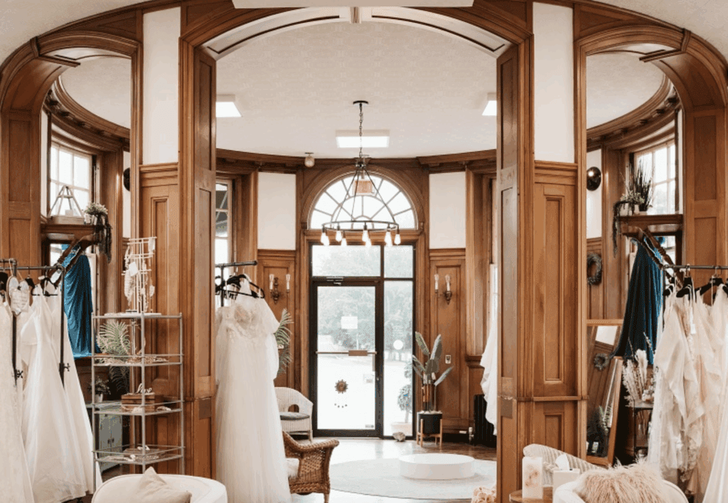 Inside Tulle Bridal, beautiful lighting with wedding dresses displayed and a seating area